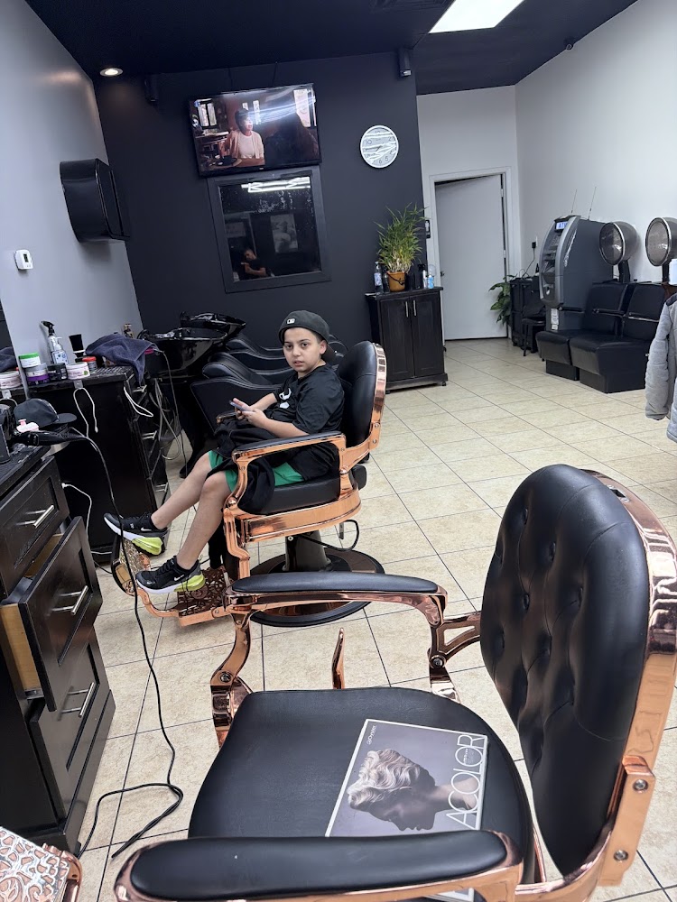 Rose gold barber chairs near the wash area