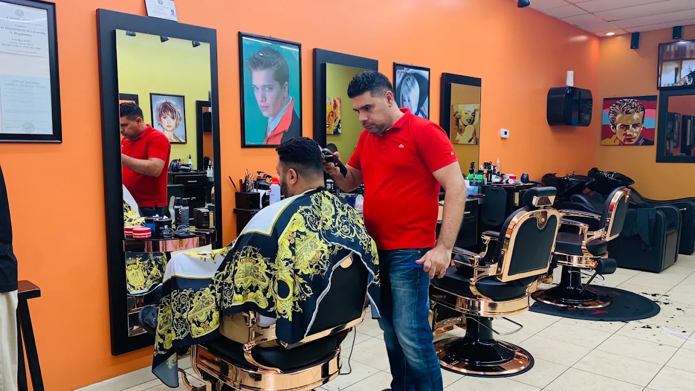Barber cutting a client's hair in a rose gold chair at Hair Fashion Salon in Houston