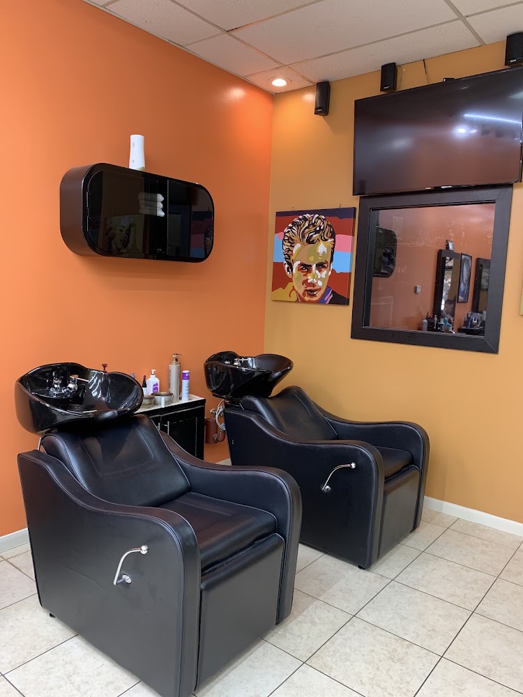 Two black leather shampoo wash stations